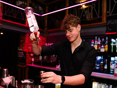 Bartender pouring drinks