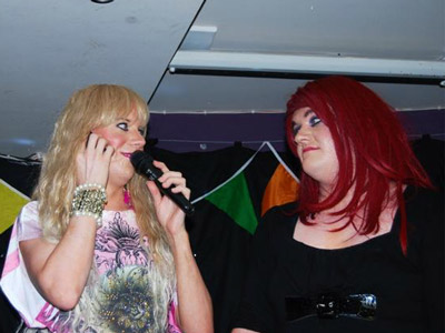 Drag queen hosts talking to each other