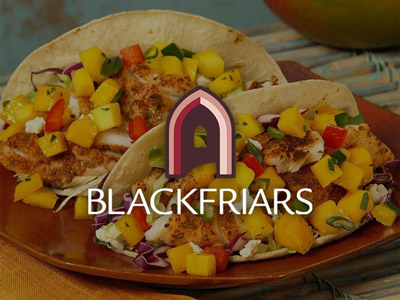 Some tacos on a plate with the Blackfriars logo over it 