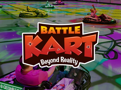A group of people go karting on a colourful track with the words Battle Kart Beyond Reality layered over it 