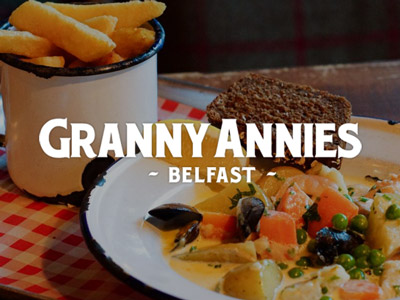 A meal of stew and some chips on the side with the words Granny Annies Belfast layered over it 