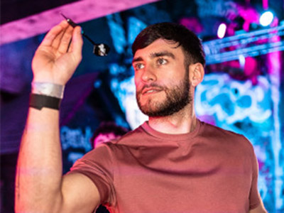 A man about to throw a dart 