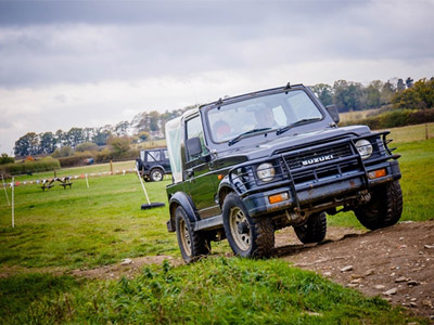 Someone driving with a blindfold on around a dirt track with Banzai Action Sports Limited in Oxford