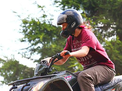 A woman driving a quad bike