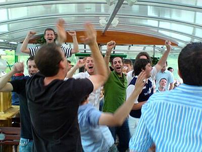 A Krakow stag group dancing inside a boat