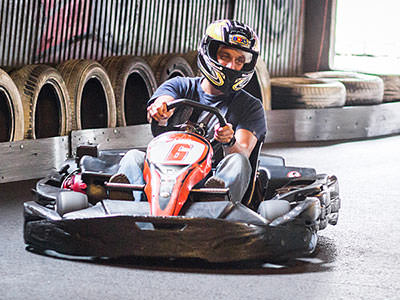 A stag driving around a go karting track in Krakow