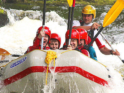 Some people in an inflated raft, white water rafting