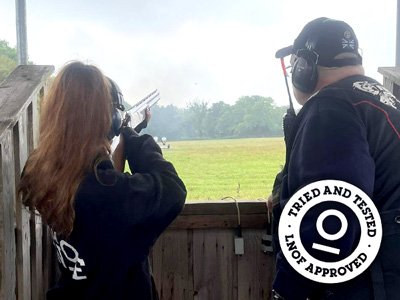 A girl shooting clay pigeons
