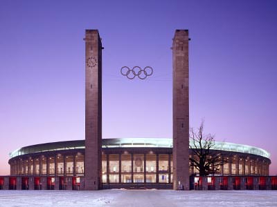 The front of the Olympic Stadium, Berlin, with the Olympic logo between two towers