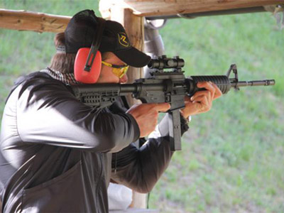 Someone aiming a gun at their target in Prague