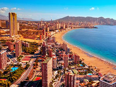 An areal shot of Benidorm's coastline and seafront buildings 