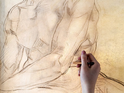 Someone drawing a male's body at a nude life drawing class