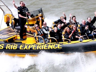 People in a speedboat on the River Thames