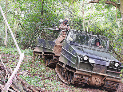 People in tanks in the forest