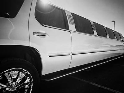The back of a white, parked-up hummer