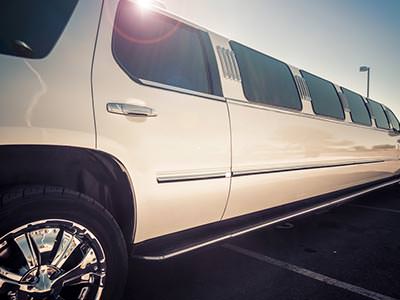A stretch SUV-style limousine with chrome wheels
