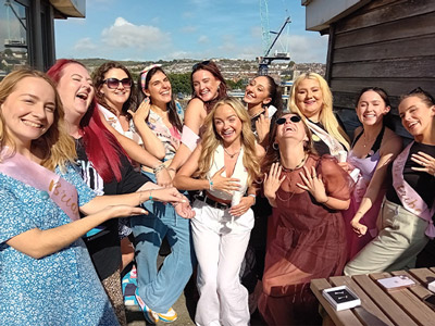 A group of women posing with their new handmade jewellery