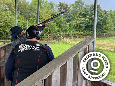 Someone aiming at a clay pigeon