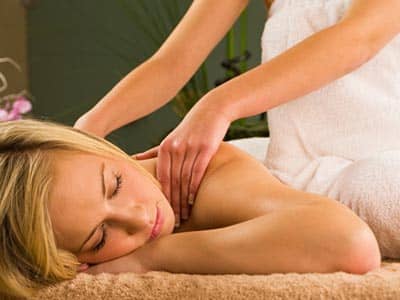 A woman receiving a back massage