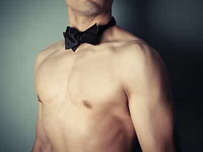 A semi-naked man in a black bowtie