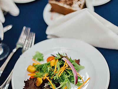 A small plate of food on a blue tablecloth