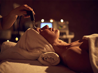 A woman getting a face treatment at a spa day in Benidorm