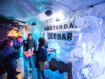 A group of people enjoying a drink in an ice bar in amsterdam