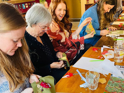 A group of women creating patchwork art