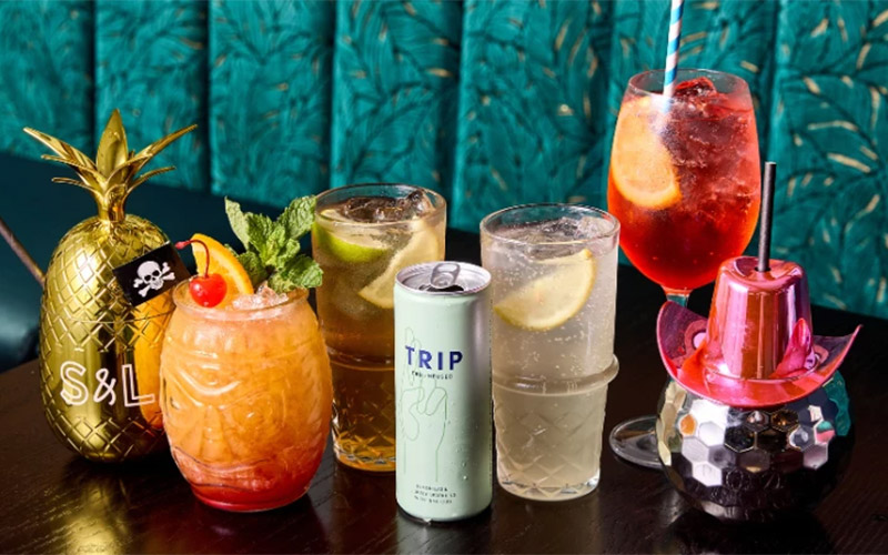 A selection of colourful drinks including one in a disco ball cup 