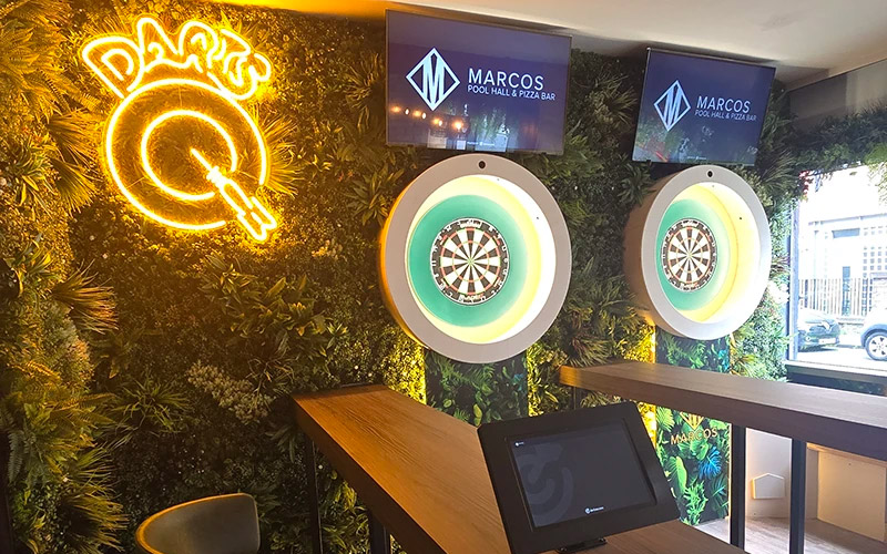Play various darts games where the board adds up your score 