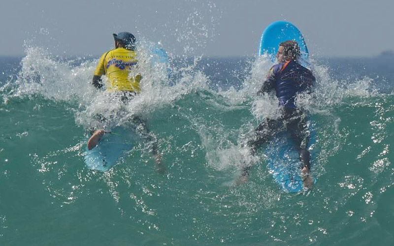 Surf board and wet suits included