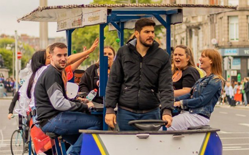 A group of people on the pedi bus in Dublin
