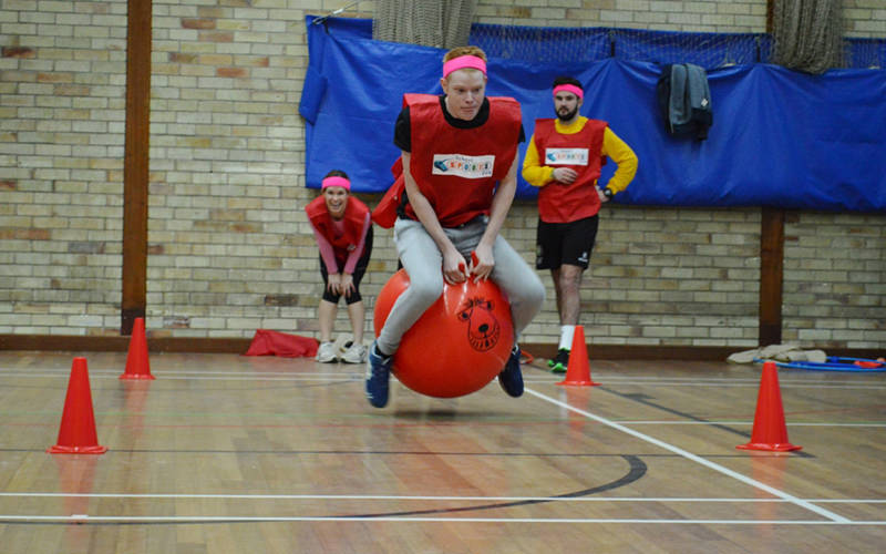  A man bouncing on a space hopper