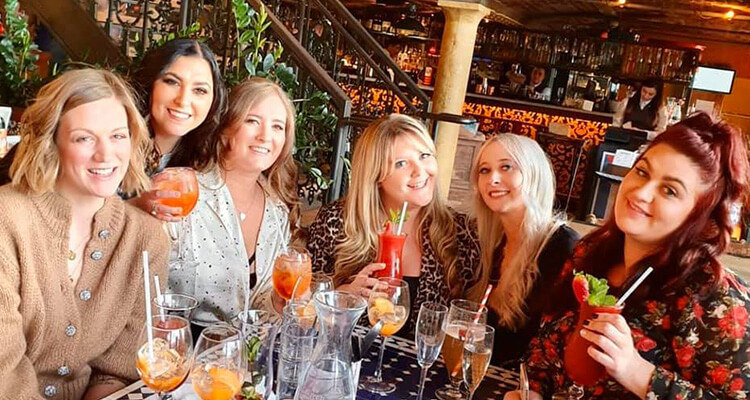 A group of women drinking at Revolución de Cuba Liverpool