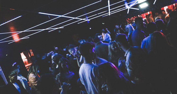 A massive crowd of people inside Ollie's Nightclub. 