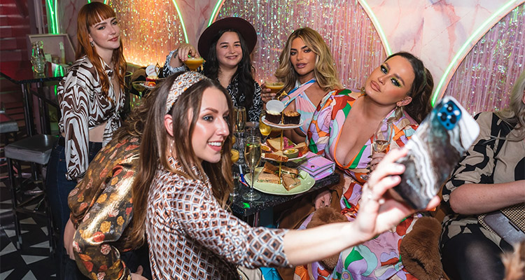 A hen do group enjoying some drinks at Tonight Josephine which has sparkly walls 