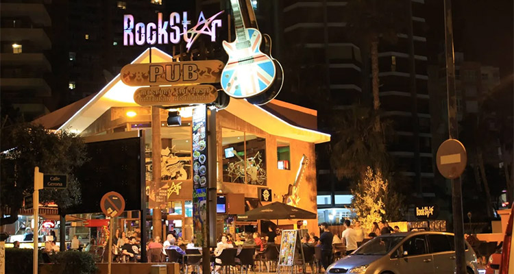 The outside of the Rockstar bar at night 
