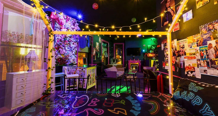 The bar at Mad House which has mismatch furniture including a four poster bed 