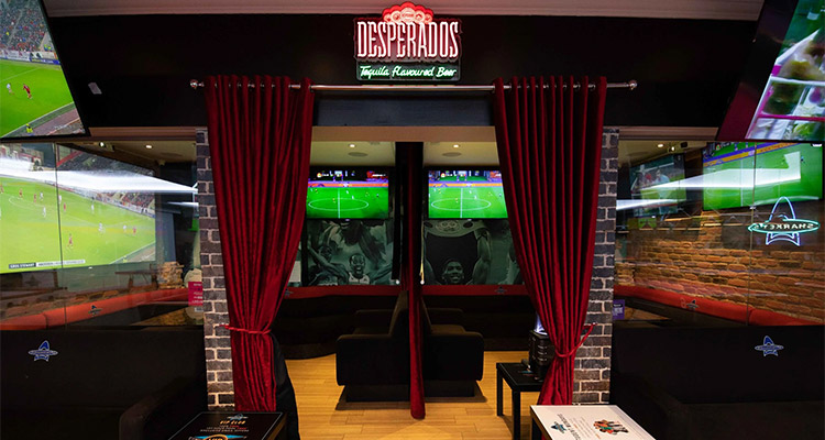  Sharkey’s Sports bar which has red curtains through to a little booth where you can watch live sports 