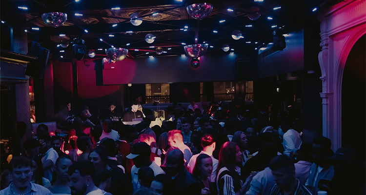 Party goers in Jalou York which is in a converted church with lots of disco balls in the ceiling 