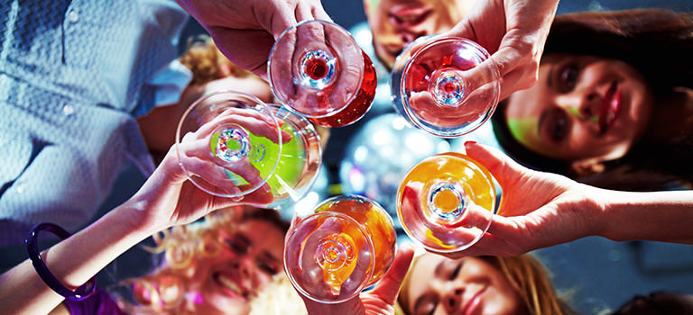 A group of women holding cocktails