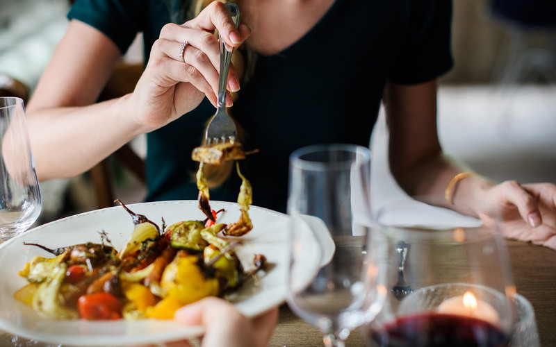 A girl eating a plate of food