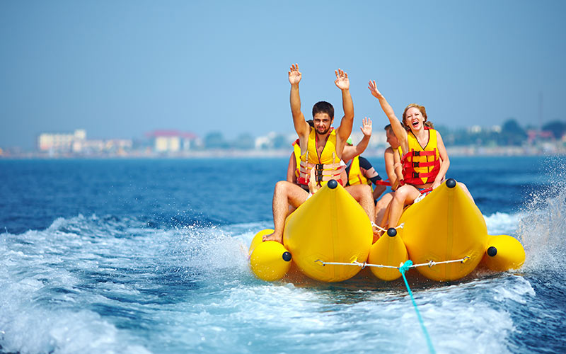 Some people on a banana boat in the sea