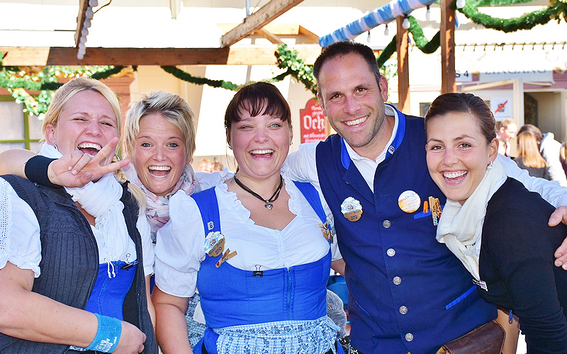Four women and a man celebrating German style
