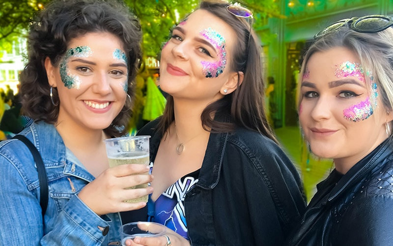 Three girls with glitter on their faces