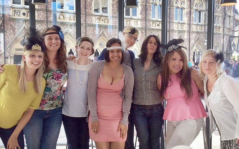 A group of girls wearing flapper headbands
