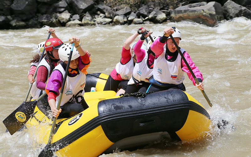 Some girls white water rafting