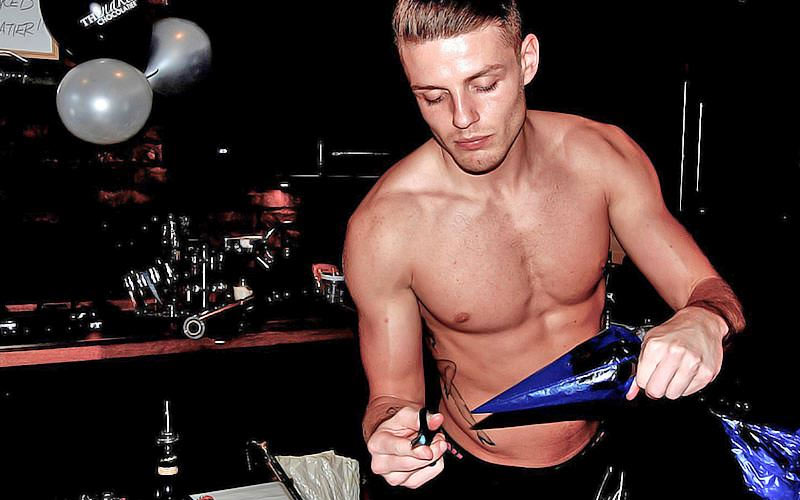 A man piping a chocolate, with no top on