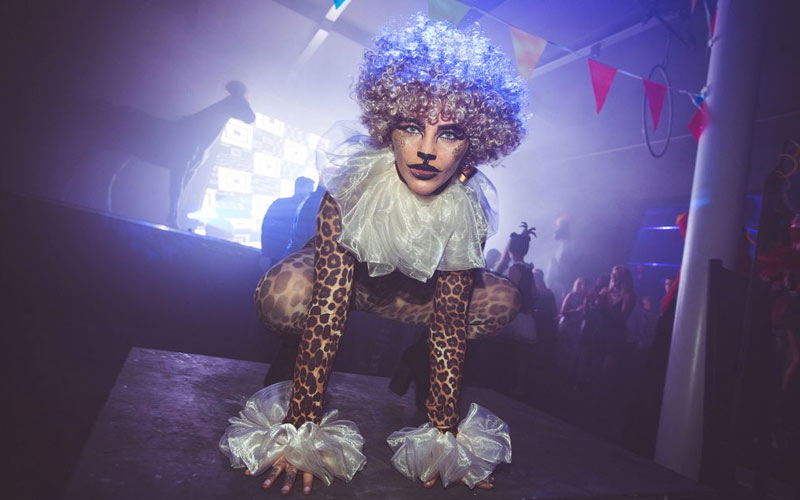 A girl wearing fancy dress in a club