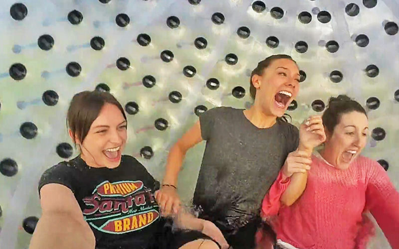 Three women inside an aquazorb